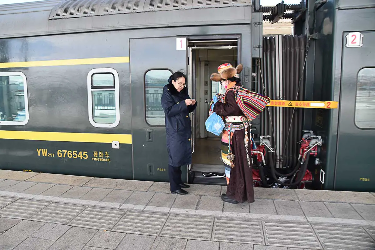 A Tibetan entering the train to Lhasa